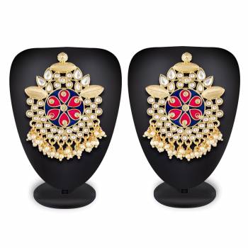 Grab This Beautiful And Attractive Pair Of Heavy Earrings Set In Golden Color. This Pretty Pair Is Beautified With Stone Work And Can Be Paired With Any Colored Traditional Attire. Buy Now.