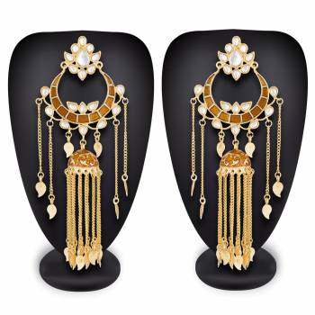 Grab This Beautiful And Attractive Pair Of Heavy Earrings Set In Golden Color. This Pretty Pair Is Beautified With Stone Work And Can Be Paired With Any Colored Traditional Attire. Buy Now.