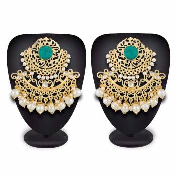 Grab This Beautiful And Attractive Pair Of Heavy Earrings Set In Golden Color. This Pretty Pair Is Beautified With Stone Work And Can Be Paired With Any Colored Traditional Attire. Buy Now.