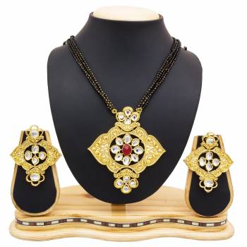 For A Heavy Look, Grab This Heavy designer Mangalsutra Set In Golden Color Beautified With Stone work. This Can Be Paired With Any Colored Heavy Ethnic Attire. Buy Now.