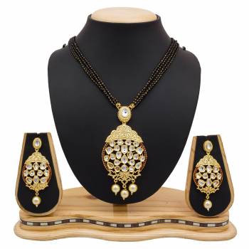 For A Heavy Look, Grab This Heavy designer Mangalsutra Set In Golden Color Beautified With Stone work. This Can Be Paired With Any Colored Heavy Ethnic Attire. Buy Now.