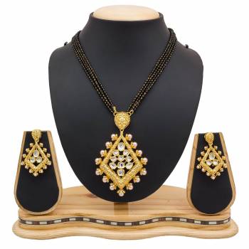 For A Heavy Look, Grab This Heavy designer Mangalsutra Set In Golden Color Beautified With Stone work. This Can Be Paired With Any Colored Heavy Ethnic Attire. Buy Now.