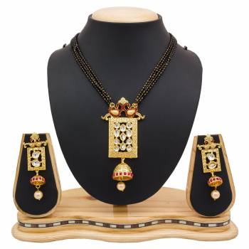 For A Heavy Look, Grab This Heavy designer Mangalsutra Set In Golden Color Beautified With Stone work. This Can Be Paired With Any Colored Heavy Ethnic Attire. Buy Now.