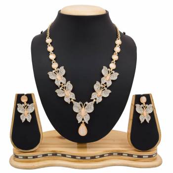 For A Girly Elegant Look, Grab This Beautiful Designer Necklace Set In Pretty Rose Gold Color. This Necklace Set Is Beautified With Diamond Work. Also This Can Be Paired With Colored Indo-Western Or Ethnic Attire. Buy Now.