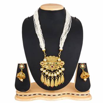 For A Queen Look, Here Is A Designer Royal Looking Necklace Set In Golden Color. This Necklace Set Can Be Paired With Heavy Ethnic Attire For More Enhanced Look. Buy Now