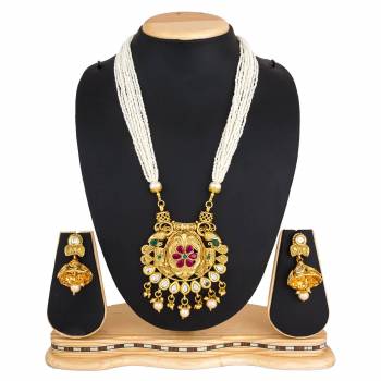 For A Queen Look, Here Is A Designer Royal Looking Necklace Set In Golden Color. This Necklace Set Can Be Paired With Heavy Ethnic Attire For More Enhanced Look. Buy Now