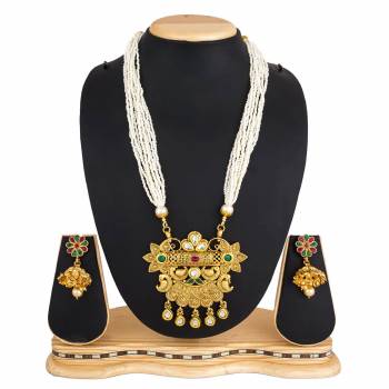 For A Queen Look, Here Is A Designer Royal Looking Necklace Set In Golden Color. This Necklace Set Can Be Paired With Heavy Ethnic Attire For More Enhanced Look. Buy Now