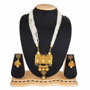 For A Queen Look, Here Is A Designer Royal Looking Necklace Set In Golden Color. This Necklace Set Can Be Paired With Heavy Ethnic Attire For More Enhanced Look. Buy Now