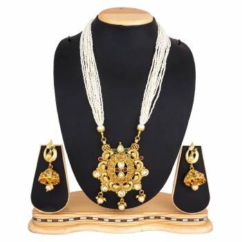 For A Queen Look, Here Is A Designer Royal Looking Necklace Set In Golden Color. This Necklace Set Can Be Paired With Heavy Ethnic Attire For More Enhanced Look. Buy Now