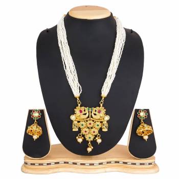 For A Queen Look, Here Is A Designer Royal Looking Necklace Set In Golden Color. This Necklace Set Can Be Paired With Heavy Ethnic Attire For More Enhanced Look. Buy Now