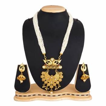 For A Queen Look, Here Is A Designer Royal Looking Necklace Set In Golden Color. This Necklace Set Can Be Paired With Heavy Ethnic Attire For More Enhanced Look. Buy Now