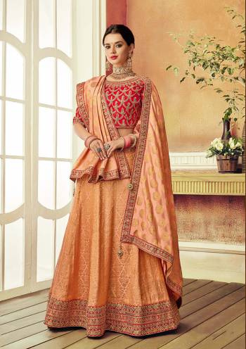 Let your style story be weaved in threads of sophistication and ladylike appeal in this peach-orange zari weaved lehenga. 