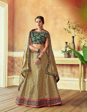 Reconnect with your opulent culture and look timelessly elegant in this weaved silk lehenga in a regal hue of green . 