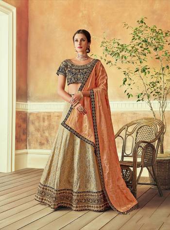 Revive Indian luxury in this regal zari weaved lehenga embellished with beautiful embroidery details. Add appealing jhumkis and choker for an ethereal look. 