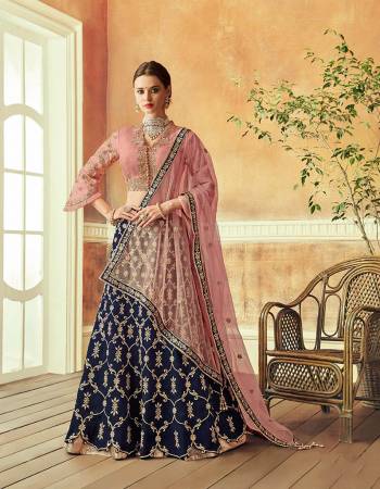 Exude an old world feminine charm in this traditionally devoted lehenga with a dash of young pink. Keep the jewels minimal and poise maximum. 