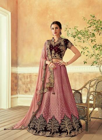 Be a vision of beauty, culture and class in this traditionally modern tinted lehenga. Drape the dupatta in classic free-fall style for subtle appearance. 