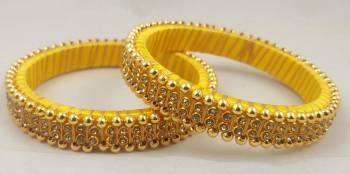 Get This Lovely Pair Of Bangles To Wear It With Your Ethnic Wear. This Pretty Pair Can Be Wore Single Or Can Be Mixed With Other Simple Bangles For Heavy Look. 