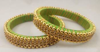 Get This Lovely Pair Of Bangles To Wear It With Your Ethnic Wear. This Pretty Pair Can Be Wore Single Or Can Be Mixed With Other Simple Bangles For Heavy Look. 