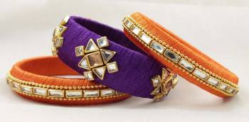 Here Is A Beautiful set Of contrasting Colored Bangles Made With Resham Thread And Stone Work. You Can Pair It Up With Either Of The Color From Both The Bagles. Also You Can Add Up With Pretty Simple Bagles To Make It As A Heavy Set. 