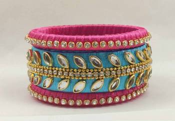 Here Is A Beautiful set Of contrasting Colored Bangles Made With Resham Thread And Stone Work. You Can Pair It Up With Either Of The Color From Both The Bagles. Also You Can Add Up With Pretty Simple Bagles To Make It As A Heavy Set. 