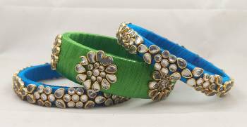 Here Is A Beautiful set Of contrasting Colored Bangles Made With Resham Thread And Stone Work. You Can Pair It Up With Either Of The Color From Both The Bagles. Also You Can Add Up With Pretty Simple Bagles To Make It As A Heavy Set. 