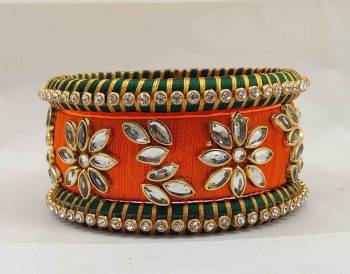 Here Is A Beautiful set Of contrasting Colored Bangles Made With Resham Thread And Stone Work. You Can Pair It Up With Either Of The Color From Both The Bagles. Also You Can Add Up With Pretty Simple Bagles To Make It As A Heavy Set. 