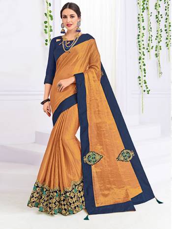 marvelously charming is what you will look at the next wedding gala wearing this beautiful Golden color banarasi silk fabrics saree. Ideal for party, festive & social gatherings. this gorgeous saree featuring a beautiful mix of designs. Its attractive color and heavy designer embroidered saree, patch design, stone design, beautiful floral design all over work over the attire & contrast hemline adds to the look. Comes along with a contrast unstitched blouse.