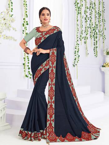 Look gorgeous in this beautiful printed Navy Blue color silk fabrics saree. Ideal for party, festive & social gatherings. this gorgeous saree featuring a beautiful mix of designs. Its attractive color and heavy designer embroidered saree, patch design, beautiful floral design all over work over the attire & contrast hemline adds to the look. Comes along with a contrast unstitched blouse.