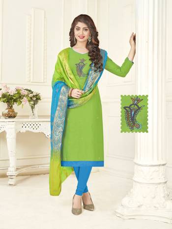 Pretty Simple Dress Material Is Here In Parrot Green Colored Top Paired With Contrasting Blue Colored Bottom And Blue And Green Shaded Dupatta. This Dress Material Is Cotton Based Paired With Banarasi Art Silk Dupatta. 