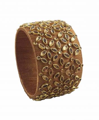 Grab This Beautiful Heavy Kada Type Bangle Which Is Wore Single In Hand. And It Does Not Need Any Other Bangle To Be Paired With. You Can Pair It Up With Any Same Or Contrasting Colored Ethnic Attire. 