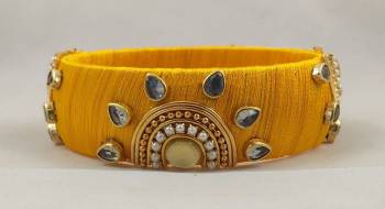 Grab This Beautiful Heavy Kada Type Bangle Which Is Wore Single In Hand. And It Does Not Need Any Other Bangle To Be Paired With. You Can Pair It Up With Any Same Or Contrasting Colored Ethnic Attire. 