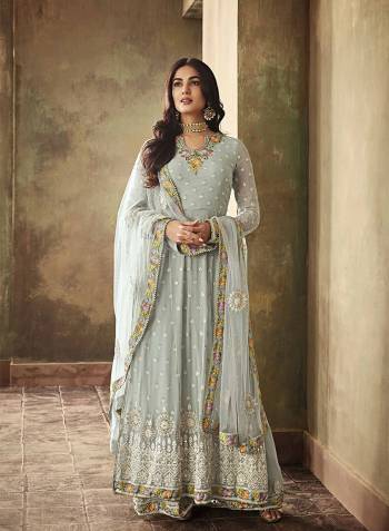 This Festive And Wedding Season, Catch All The Lime Light Wearing This Designer Indo Western Suit In Pretty Baby Blue Color. Its Top Is Fabricated On Georgette Paired With Santoon Bottom And Net Fabricated Dupatta. Also It Comes With A Stitched Sharara So That You Can Wear It In Two Ways As Per The Occasion. 