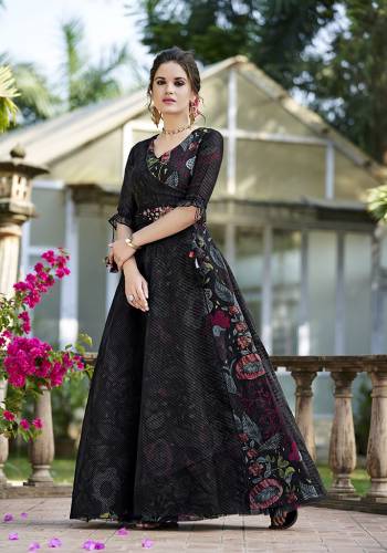 Grab This Designer Unique Patterned Gown In Black Color Fabricated On Oragenza Beautified With Prints Paired With A Black Colored Orgenza Fabricated Jacket And An Embroidered Belt.  