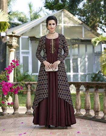 Add This Beautiful Designer Maroon Colored Gown To Your Wardrobe For The Upcoming Festive And Wedding Season. Also It IS Paired With A Multi Colored Tussar Art Silk Fabricated Jacket. 