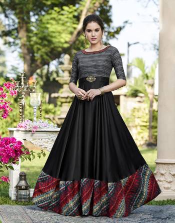 For A Bold And Beautiful Look, Grab This Designer Gown In Black And Grey Color Fabricated On Cotton Satin. Its Fabric Is Soft Towards Skin And Easy To Carry Througout The Gala. Buy Now. 