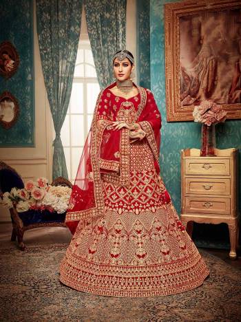 Here Is A Perfect Bridal Look For You With This Heavy designer Lehenga Choli In Red Color. This Lehenga Choli Is Velvet Based Paired With Net Fabricated Dupatta.Its Fabric Also Ensures Superb Comfort Throughout The Gala