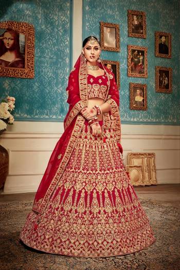 Get Ready For Your Big Day With This Heavy Designer Lehenga Choli?In Red Color. This Heavy Embroidered Lehenga Choli Is Fabricated On Velvet Paired With Net Fabricated Dupatta. It Is Beautified With Heavy Jari & Thread Embroidery and Stone Work. Buy Now