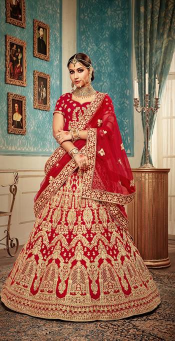 Get Ready For Your Big Day With This Heavy Designer Lehenga Choli?In Red Color. This Heavy Embroidered Lehenga Choli Is Fabricated On Velvet Paired With Net Fabricated Dupatta. It Is Beautified With Heavy Jari & Thread Embroidery and Stone Work. Buy Now