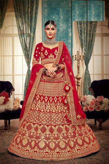 Here Is A Perfect Bridal Look For You With This Heavy designer Lehenga Choli In Red Color. This Lehenga Choli Is Velvet Based Paired With Net Fabricated Dupatta.Its Fabric Also Ensures Superb Comfort Throughout The Gala