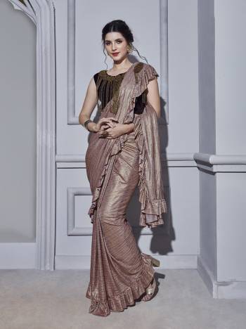 Look Pretty Wearing This Designer Ready To Wear Saree In Dusty Pink Color Paired With Dark Wine Colored Blouse. This Saree And Blouse Are Fabricated On Fancy Fabric Beautified Pretty Hand Work Making It More Attractive. Buy this Designer Saree Now.