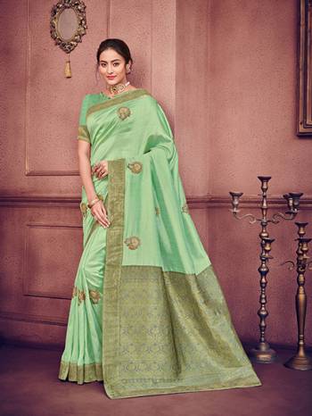 marvelously charming is what you will look at the next wedding gala wearing this beautiful Light green color two tone silk fabrics saree. Ideal for party, festive & social gatherings. this gorgeous saree featuring a beautiful mix of designs. Its attractive color and heavy designer embroidered saree, patch design, stone design, beautiful floral design all over work over the attire & contrast hemline adds to the look. Comes along with a contrast unstitched blouse.