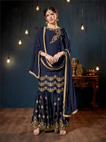 Get Ready For The Upcoming Festive And Wedding Season With This Heavy Designer Sharara Suit In Navy Blue Color. Its Top And Bottom Are Fabricated On Satin Georgette Paired With Chiffon Fabricated Dupatta. It Is Beautified Heavy Embroidery Over The Top And Bottom Both. 