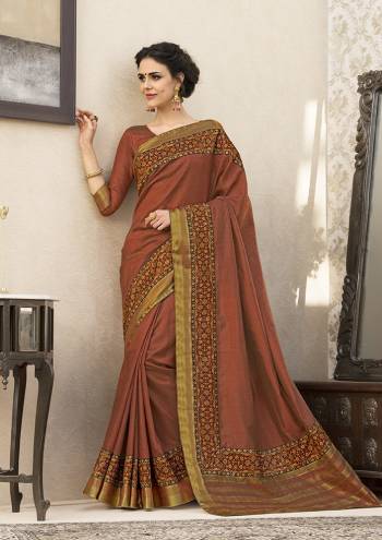 New Shade Is Here To Add Into Your Wardrobe With This Saree In Rust Color Paired With Rust Colored Blouse. This Saree And Blouse Are Fabricated On Art Silk Beautified With Printed Lace Border. 