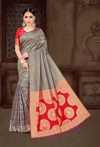 Look Pretty In This Lovely Navy Blue And golden Colored Saree Paired With Contrasting Red Colored Blouse. This Saree And Blouse Are Fabricated On Art Silk Beautified With Heavy Weave All Over. 