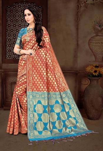 For A Bold And Beautiful Look Grab This Saree In Red Color Paired With Blue Colored Blouse. It Is Fabricated On Art Silk Beautified With Attractive And Heavy Weaving All Over It.