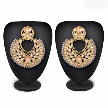 Grab This Beautiful And Attractive Pair Of Heavy Earrings Set In?Golden Color. This Pretty Pair Is Beautified With Stone Work And Can Be Paired With Any Colored Traditional Attire. Buy Now.