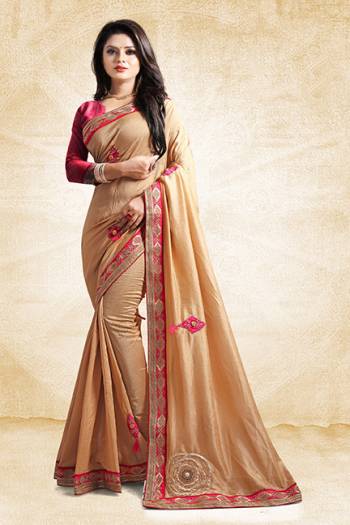 Here Is A Rich And Elegant Looking Designer Saree In Beige Color Paired With Contrasting Dark Pink Colored Blouse. This Saree And Blouse Are Silk Based With A Very Pretty Color Pallete Which Earn You Lots Of Compliments From Onlookers. 