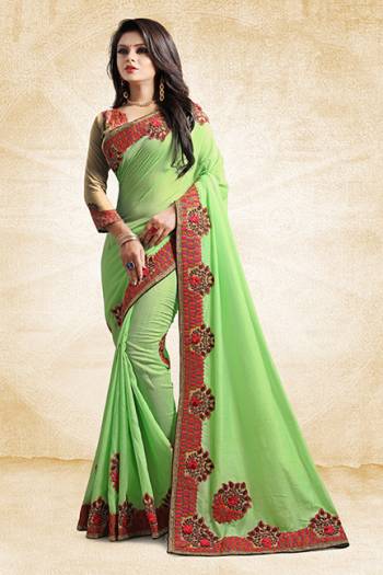 Add This Pretty Designer Saree To Your Wardrobe In Green Color Paired With Golden Colored Blouse. This Saree And Blouse Are Silk Based Beautified With Heavy Embroidered Lace Border. Buy Now.