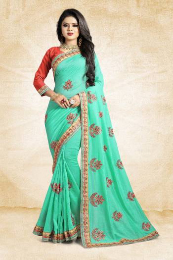 Celebrate This Festive Season With Colorful Attire. Grab This Designer Saree In Sea Green Color Paired With Contrasting Red Colored Blouse. This Saree And Blouse Are Rich Silk Based Beautified Embroidery All Over. Buy Now.