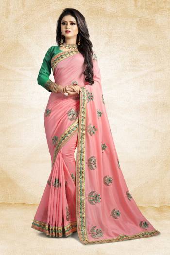 Celebrate This Festive Season With Colorful Attire. Grab This Designer Saree In Pink Color Paired With Contrasting Green Colored Blouse. This Saree And Blouse Are Rich Silk Based Beautified Embroidery All Over. Buy Now.